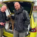 PC Phil Lusby passing on Quinta's lead to her former handler, Mick Tune.
