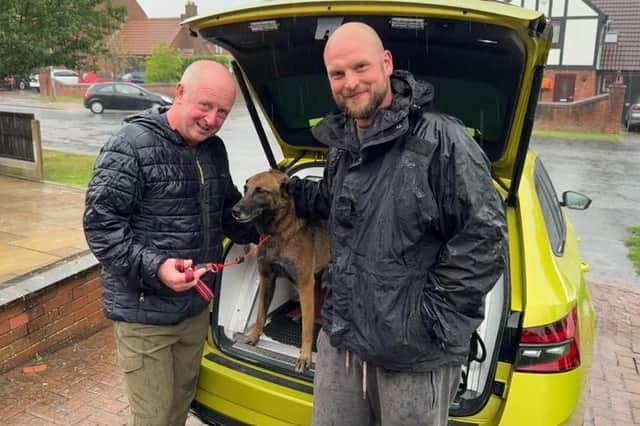 PC Phil Lusby passing on Quinta's lead to her former handler, Mick Tune.