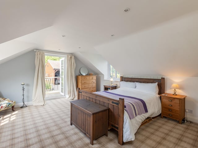 A double bedroom with balcony.