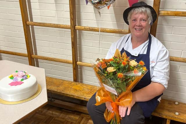 Susan Bell with flowers to mark her 32 years at Oakridge School at Hinderwell.