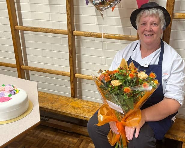 Susan Bell with flowers to mark her 32 years at Oakridge School at Hinderwell.