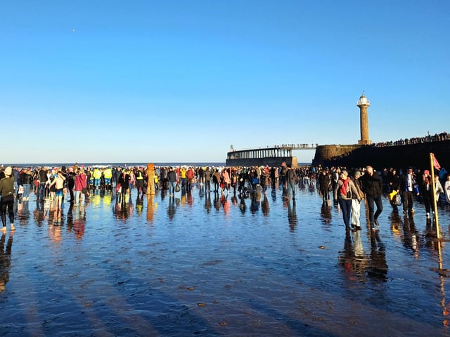Boxing Day dippers on the beach.