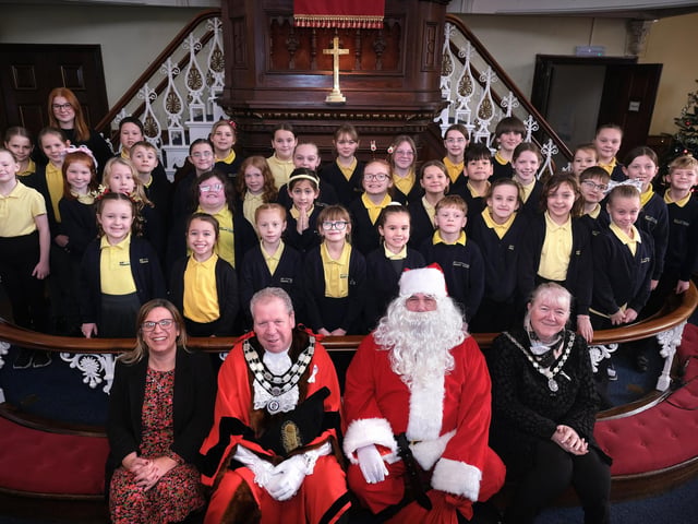 Bay Primary School Choir with Head Helen Gee, Mayor of Bridlington Rick Arrand, Santa and Mayoress Kim Arrand.