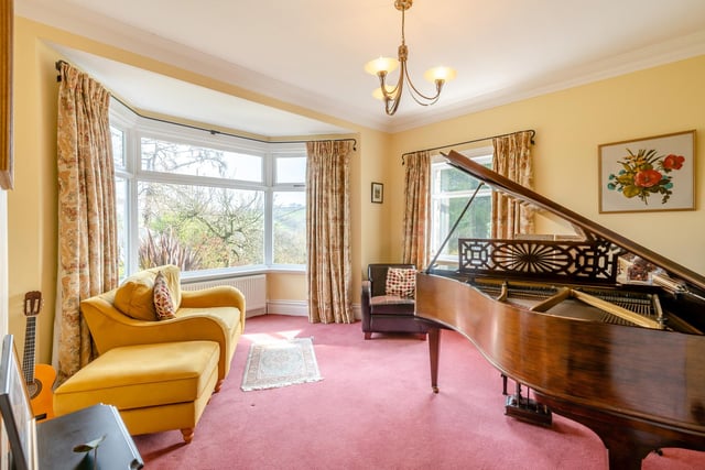 This bay-fronted reception room is currently used as a music room.