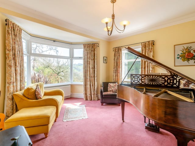 This bay-fronted reception room is currently used as a music room.