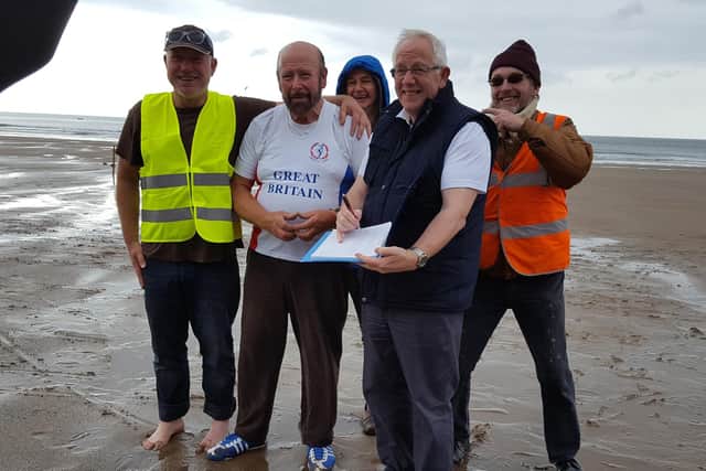 Paul Wheater at the throw-athon, where the threw the hammer on Whitby beach for a total distance of one mile.