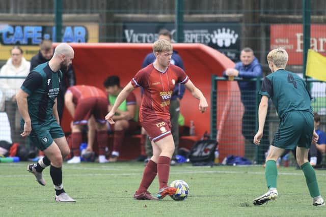 Newby players close in on Brid Rovers Reserves. Photos by TCF Photography