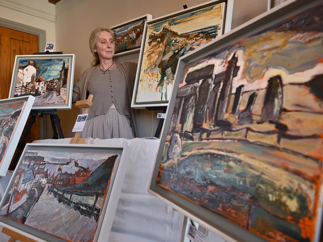 Artist Susan Isaac with her art. photo: Richard Ponter