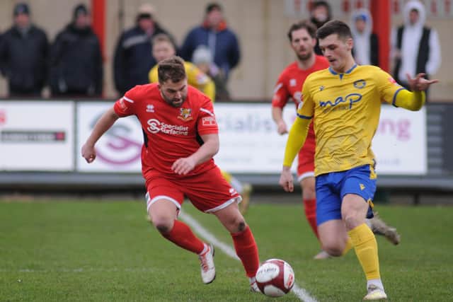 Andrew Norfolk looks to get the ball away from a Stockton player in Saturday's game at Queensgate.PHOTOS BY DOM TAYLOR