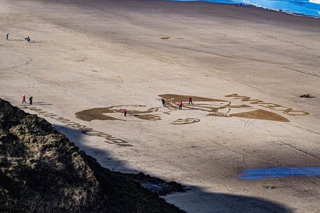 Sand in Your Eye created land sand art at Cayton Bay near Scarborough featuring Prime Minister Rishi Sunak with a fish in his mouth and the strapline #EndDestructiveFishing. (Pic credit: Tony Johnson)