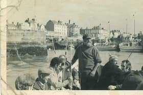 A photo of Leonard Shaw Broadbent on a coble out of the harbour.