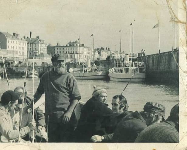 A photo of Leonard Shaw Broadbent on a coble out of the harbour.