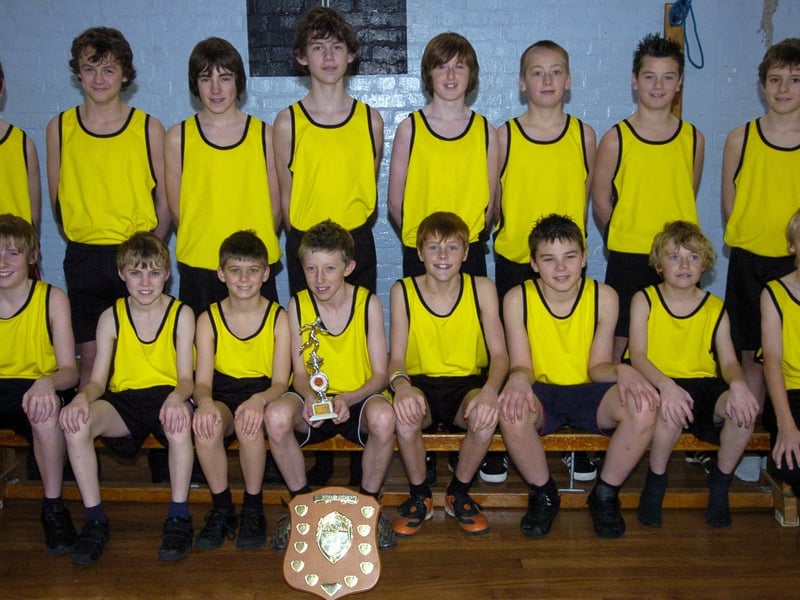 Pictured is the Caedmon School cross country boys team with their winning trophies.