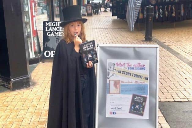 A young reader of Marmalade's book at an event in Bridlington, dressed for the occasion.