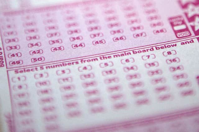 A woman from Surrey has won £1,000,000 on the National Lottery after matching five main numbers and the bonus ball in the Lotto draw on Saturday, May 31. Picture by SHAUN CURRY/AFP via Getty Images