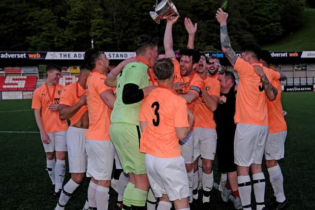 The Edgehill players celebrate their District Cup final win.