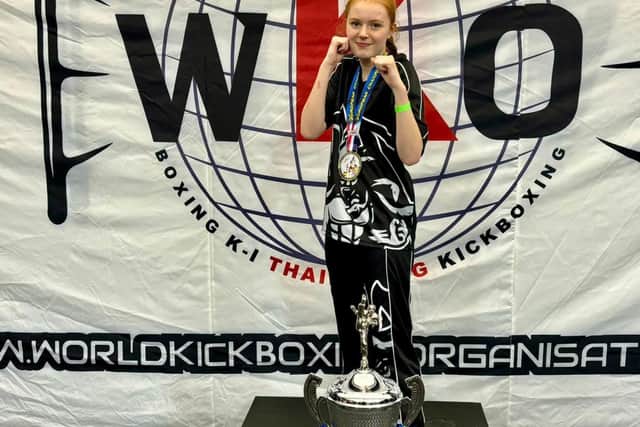 Sarah Dicks shows off her silverware after a treble win at the WKO British Championships.