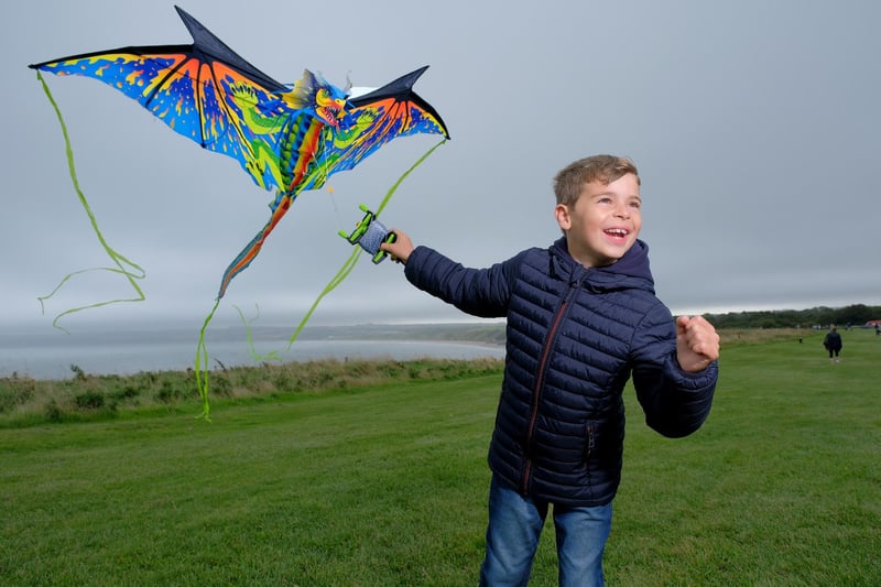 Charlie flies his dragon kite