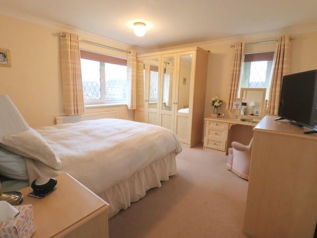 The property has four bedrooms, one of which has fitted wardrobes.