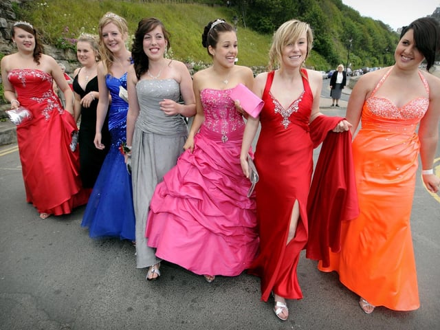 One of the first groups of students to arrive make an impression by strolling arm in arm from their limo.