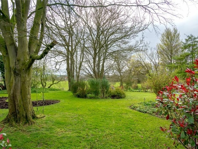 Beautiful grounds adjoin open countryside.