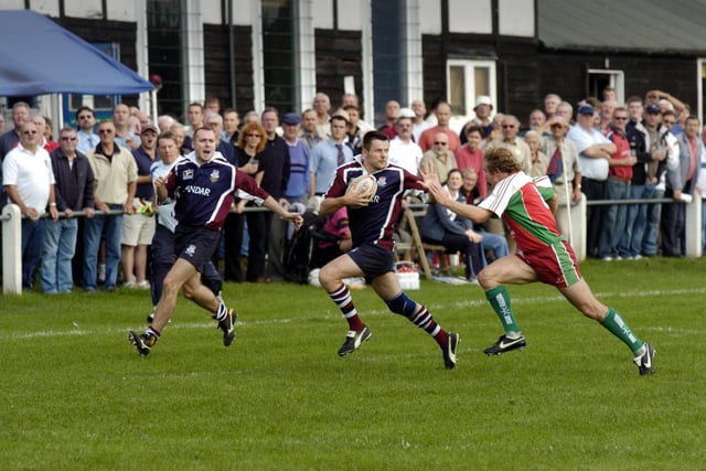 Do you recognise either of these Scarborough RUFC players in action v Keighley, or any member so the crowd who turned out to see the action at the old Newby ground