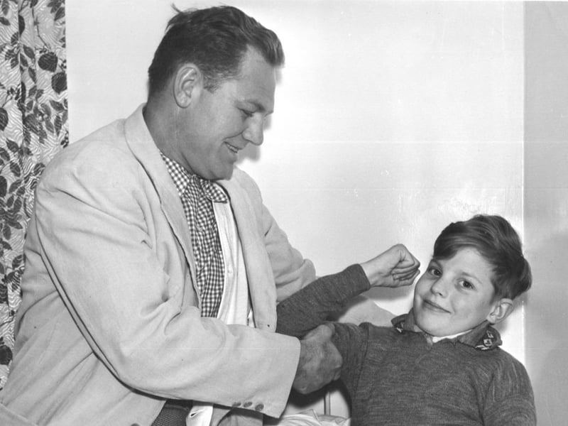 Lee Savold, American heavyweight, visiting children's convalescent home on Filey Road. (Year unknown)