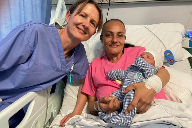 Celebrating 1,000 babies for BaBi: Research Midwife Marie Home, mum Danielle Woodward and baby son Leif.