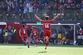 Lewis Maloney, number four, reels away to celebrate his late winner against Chester on Saturday. PHOTOS BY ZACH FORSTER