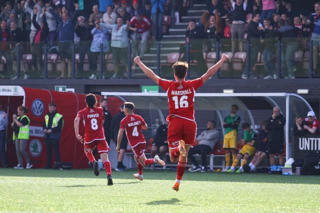Lewis Maloney, number four, reels away to celebrate his late winner against Chester on Saturday. PHOTOS BY ZACH FORSTER