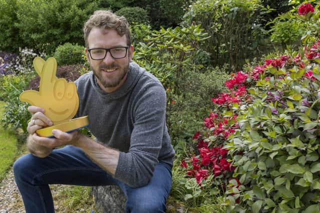 JJ Chalmers holds a National Lottery Game Changers trophy