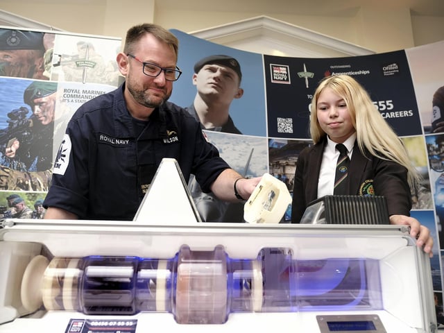 David Wilson representing the Royal Navy with a Caedmon student