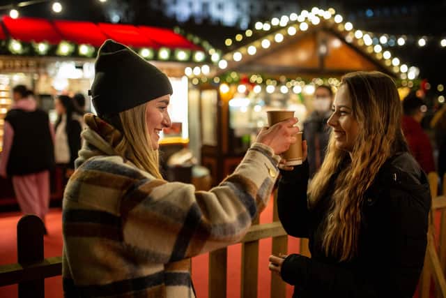 Warming the cockles with a mulled wine at Trafalgar Square. Image: Pasco Photography