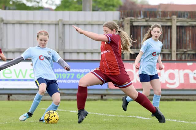 The hosts, maroon kit, at full stretch against Beverley. PHOTOS: TCF PHOTOGRAPHY