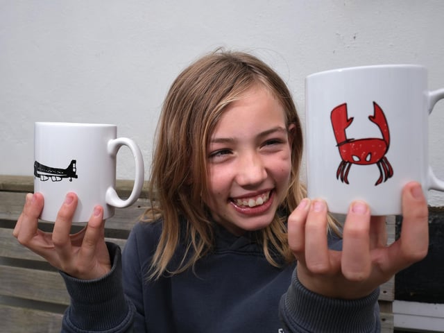 Violet sells her designer mugs.