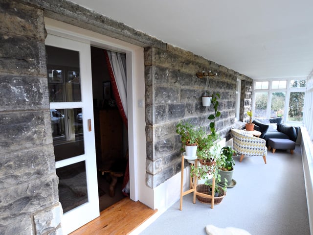The covered balcony or sunroom, with far reaching views.