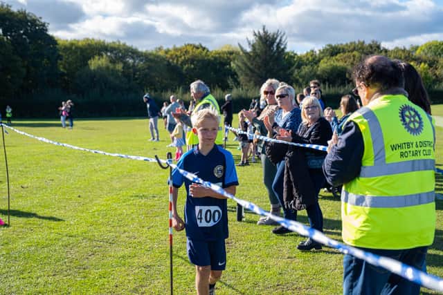 Finlay Peoples, of Airy Hill School, finishes the race. Photo by Amelia Dyson of Elana Belle Photography