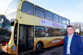 Councillor Leo Hammond pictured with an East Yorkshire bus displaying an advert promoting DVAP (Domestic Violence and Abuse Partnership) in the East Riding.
