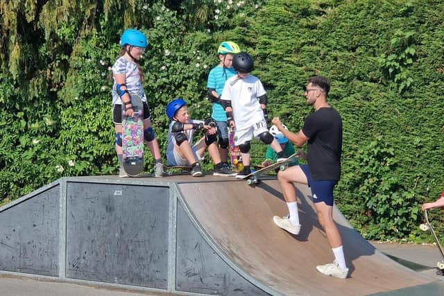 Ryan Swain working with youngsters at the skate park