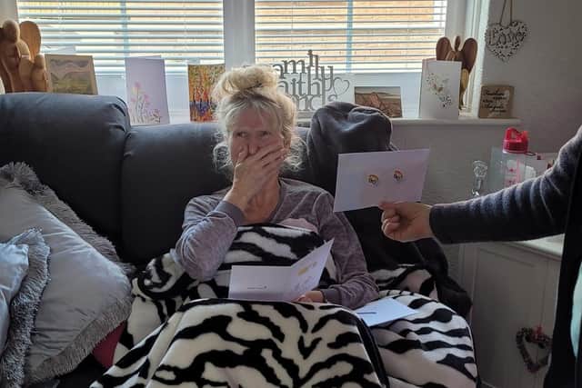 Janie receives the card from her colleagues at Mainline Menswear