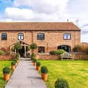 Chestnut Barn stands within impressive gardens and has a double garage.