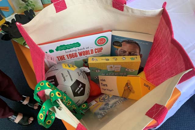 The contents of a memory bag, which aim to promote conversations between people with memory loss as well as their family and friends.