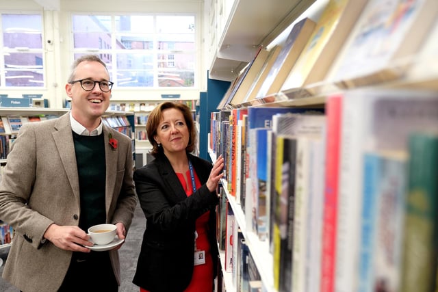 Lord Parkinson gets a tour of the library from Hazel Smith.
