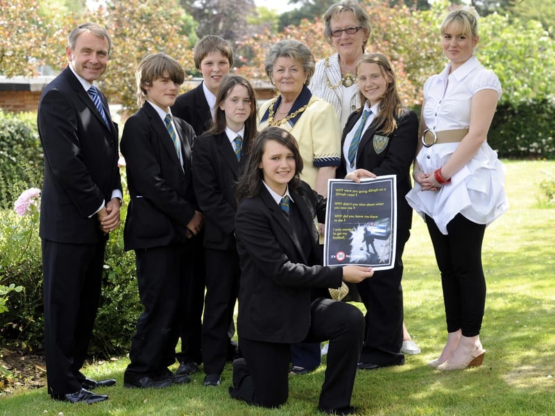 Scalby School road safety project award winners, organised by teacher Annabelle Atkinson(R) in memory of her brother Byron. The winning team, kneeling, Emily Watkinson(designed the poster) Jacob Hopper(standing left), Michael Mort, Amy Sewell, and Rebecca Foulger, with Robert Goodwill MP, and Mayor and Mayoress Hazel Lynskey and Sheila Kettlewell, who chose the winning work.
102764a