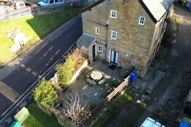 An overview of the cottage with its west-facing courtyard style garden.