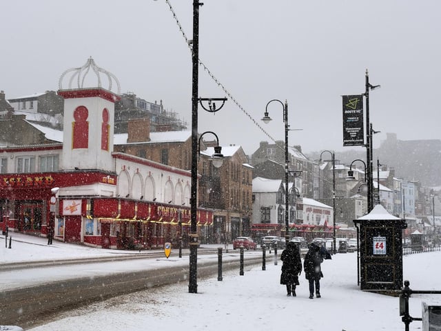 Snow falling on South Bay