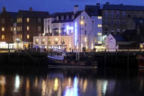 The New Angel Hotel at night.