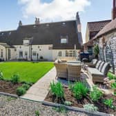 The private lawned garden lies to the rear of the house.