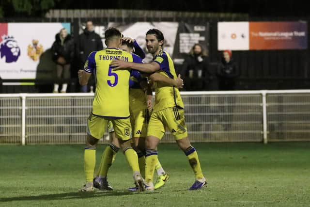 Will Thornton and Alex Purver celebrate with Lewis Maloney after his late leveller at Spennymoor on December 30. Photo by Jack Boys