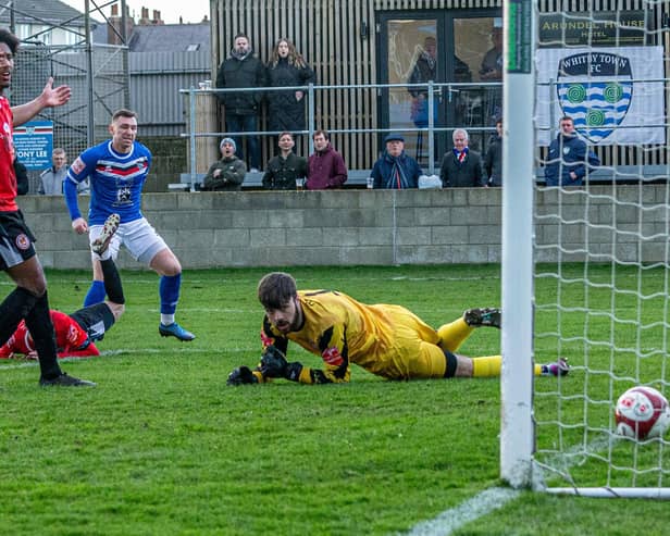 Nathan Thomas puts Whitby Town 1-0 ahead against Hyde United on Saturday. PHOTOS BY BRIAN MURFIELD